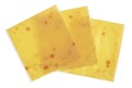 Plates of melted cheese with pieces of bacon in square plastic bags isolated