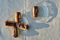 Plates of mini eclairs on checked tablecloth Royalty Free Stock Photo