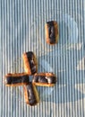 Plates of mini eclairs on checked tablecloth Royalty Free Stock Photo