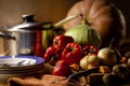 Plates, pans and set of vegetables Royalty Free Stock Photo