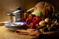 Plates, pans and set of vegetables Royalty Free Stock Photo