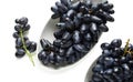 Plates with ripe sweet grapes on white background Royalty Free Stock Photo