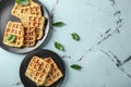 Plates with tasty squash waffles on light table