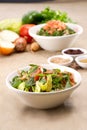 Plates of traditional Arabic salad fattouch and tabbouleh on a rustic background Royalty Free Stock Photo