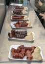 Plates of varieties of Viennese sausage on a food tour, Vienna, Austria Royalty Free Stock Photo