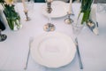 Plates at the wedding banquet. Table setting. Wedding decoration Royalty Free Stock Photo