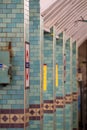 Platform at Aldgate Underground Station, London showing station name in TFL roundel.