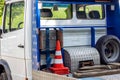 The platform from the back of an evacuator car with the red road cones and wheel.