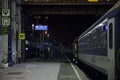 Platform of the Budapest Nyugati palyaudvar train station at night with a late evening train ready for departure Royalty Free Stock Photo