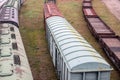 Platform and covered wagons. Several railway tracks. Logistics, import and export