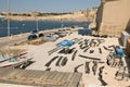 Vittoriosa, Malta, August 2019. Ship anchor chains on drying after painting.