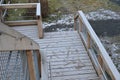 Platform of a lookout tower made of oak logs and planks with barrier-free access for seniors and the immobile. wheelchair ramp. me