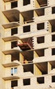 platform for taking heavy load with a crane in the construction multi-storey building apartment. Royalty Free Stock Photo