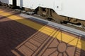 Platform at a train station in Padua with yellow stripes stay behind yellow line warning sign Royalty Free Stock Photo