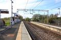 Platform at the train station with train track lines