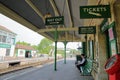 The platforms at Corfe Castle railway station with the station Master waiting for the arrival of an heritage steam train