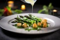 plating gnocchi with asparagus with tong