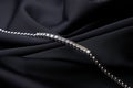 Platinum bracelet with diamonds on black silk background Royalty Free Stock Photo