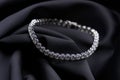 Platinum bracelet with diamonds on black silk background Royalty Free Stock Photo