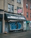 Platinum Liquors sign on a snowy winter day in Crown Heights, Brooklyn, New York