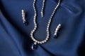 Platinum necklace and earrings with a diamond and blue precious