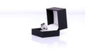 Platinum ring with blue sapphire and diamond in dark blue jewel box. Collection of natural gemstones accessories. Studio shot Royalty Free Stock Photo