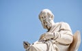 Plato, the ancient Greek philosopher white marble statue on sky background.