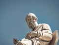 Plato, the ancient Greek philosopher white marble statue on sky background.