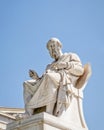 Plato, the ancient Greek philosopher white marble statue on sky background.