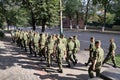 Platoon of soldiers going through the city