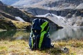PLATTACHSEE , AUSTRIA 20 September , 2020  Deuter hiking backpack in front of the mountain lake `Plattachsee` when the weather is Royalty Free Stock Photo