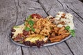 Platter of appetizers on wooden table Royalty Free Stock Photo