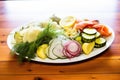 platter of assorted pickles, cucumbers, and onions