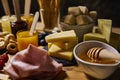 Platter of cold cuts and cheeses with spicy mustard jams and snacks Royalty Free Stock Photo