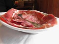 Platter of cold cuts with rustic ham prosciutto and salami from Tuscany, Italy Royalty Free Stock Photo