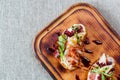 Platter: cold salmon bruschetta and greens with a glass of champagne Royalty Free Stock Photo