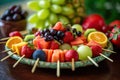 Platter of colorful fruit kabobs with a variety of fresh fruits Royalty Free Stock Photo