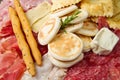 Platter of cured meats, cheeses and fried dumpling