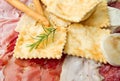 Platter of cured meats, cheeses and fried dumpling Royalty Free Stock Photo