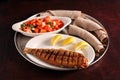 Platter of Ethiopian grilled fish, salad, and injera bread