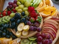 A platter of fresh fruit set on the table, ready to be served for breakfast Royalty Free Stock Photo