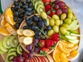 A platter of fresh fruit set on the table, ready to be served for breakfast Royalty Free Stock Photo