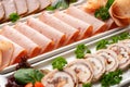 Platter of fresh meat cold cuts on table Royalty Free Stock Photo
