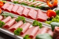 Platter of fresh meat cold cuts on table Royalty Free Stock Photo