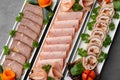 Platter of fresh meat cold cuts on table Royalty Free Stock Photo