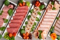 Platter of fresh meat cold cuts on table Royalty Free Stock Photo
