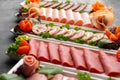 Platter of fresh meat cold cuts on table Royalty Free Stock Photo