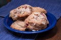 Platter of fresh scones with wooden, blue background