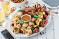 A platter of game day appetizers include pigs in a blanket and jalapeno poppers. Royalty Free Stock Photo