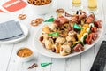 A platter of game day appetizers ready for sharing and served with beer. Royalty Free Stock Photo